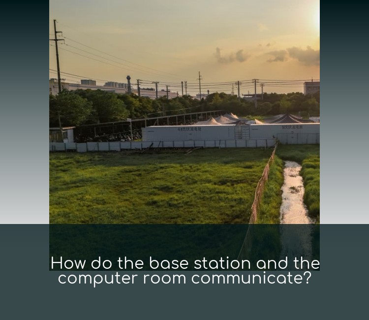 How do the base station and the computer room communicate?